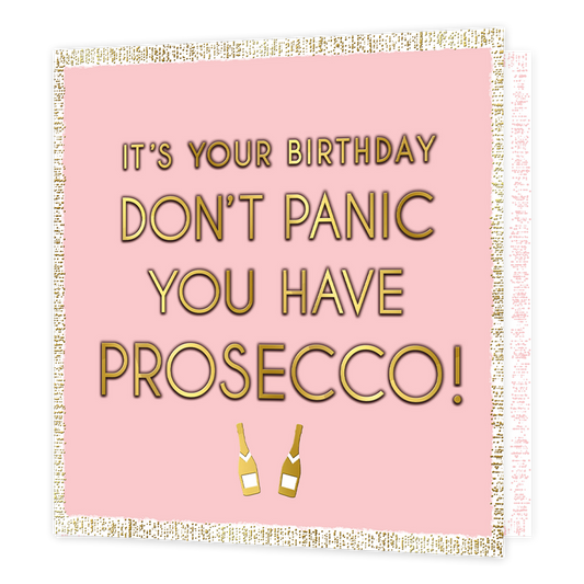 It's your birthday don't panic you have prosecco! - Formaat: Standaard - Vorm: Vierkant - Verjaardagskaart - Op deze kaart staat de tekst 'It's your birthday don't panic you have prosecco!' in het goud met een schaduw erachter. Onder de tekst staan twee gouden champagne flessen. De tekst en flessen staan in een roze vierkant. Buitenom het vierkant is een witte achtergrond met gouden stippen. - Snelwenskaart