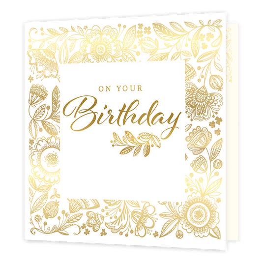 On your birthday - Formaat: Standaard - Vorm: Vierkant - Verjaardagskaart - Op deze kaart staat de tekst 'On your birthday' in het goud in een wit vierkant. Hierachter staan allerlei verschillende bloemen in een gouden kleur. - Snelwenskaart