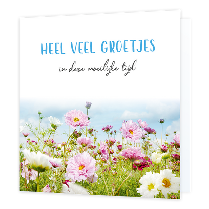 Heel veel groetjes - Formaat: Standaard - Vorm: Vierkant - Denken aan kaart - Op deze wenskaart staat een bloemenveld met daarboven de tekst: "Heel veel groetjes in deze moeilijke tijd". - Snelwenskaart