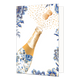 Champagne - Formaat: Standaard - Vorm: Staand - Blanco kaart - Op deze wenskaart staat schuin aan de linkerzijde een openspringende champagnefles afgebeeld, waarvan de fles zelf rijkelijk is versierd met een blauw-wit bloemmotief in Delfts blauwe stijl en goudkleurige randen. Uit de fles schiet een kurk omhoog, die vergezeld wordt door een feestelijke stroom van talrijke goudkleurige spikkels die bubbels symboliseren. De randen en hoeken van de kaart zijn op een effen witte achtergrond versierd met bijpass