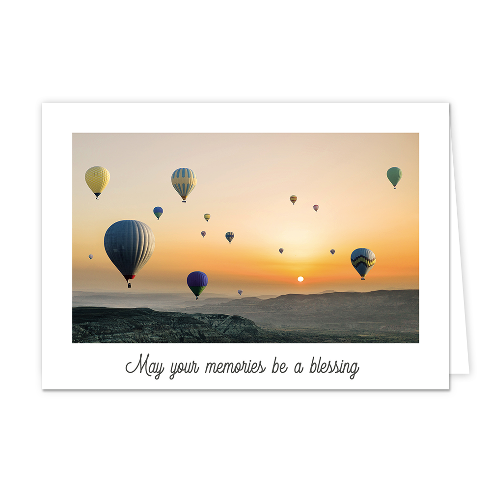 May your memories be a blessing - Formaat: Standaard - Vorm: Liggend - Condoleance kaart - Op deze wenskaart staan ballonnen bij een berggebied, met een opkomende zon. Onder de illustratie staat de tekst: "May your memories be a blessing". - Snelwenskaart
