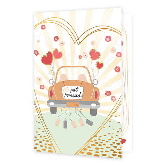 Just married - Formaat: Normaal - Vorm: Staand - Huwelijkskaart - Op deze wenskaart staat een speelse illustratie van een oranje trouwauto van achteren gezien, rijdend over een weg met stippen. Aan de auto hangen blikjes aan touwtjes en vier rode, hartvormige ballonnen. Op de achterruit staat de tekst "just married" met twee gouden ringen, en op de bumper staat een klein bordje met "Mr & Mrs". De scène wordt omlijst door een groot goudkleurig hart, waarbinnen zonnestralen en kleine bloemetjes en hartjes te