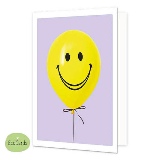 Ballon met smiley - Afmeting: {"value":9.7,"unit":"CENTIMETERS"} x {"value":13.4,"unit":"CENTIMETERS"} - Formaat: Klein - Vorm: Staand - Blanco kaart - Op deze wenskaart staat een gele ballon met een smiley erop, op een paarse achtergrond. - Snelwenskaart