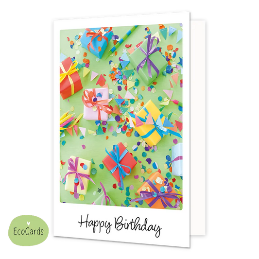Happy birthday - Afmeting: {"value":9.7,"unit":"CENTIMETERS"} x {"value":13.4,"unit":"CENTIMETERS"} - Formaat: Klein - Vorm: Staand - Verjaardagskaart - Op deze wenskaart is een kleurrijke verzameling van ingepakte cadeautjes en strooiconfetti te zien op een lichtgroene achtergrond. De diverse geschenken zijn versierd met gekleurde linten en strikken, omringd door kleine driehoekige vlaggetjes en feestelijke snippers. Onderaan de illustratie staat in een zwart, handgeschreven lettertype de tekst "Happy Birt