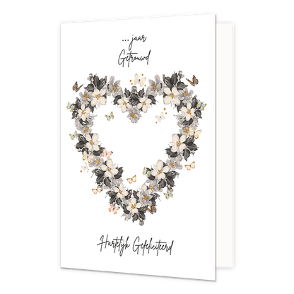 Jaar getrouwd gefeliciteerd - Formaat: Normaal - Vorm: Staand - Huwelijkskaart - Op deze wenskaart staat een hartje gemaakt van bloemen en omringt door vlinders. In de illustratie staan de teksten: "... jaar getrouwd" en "Hartelijk gefeliciteerd". - Snelwenskaart