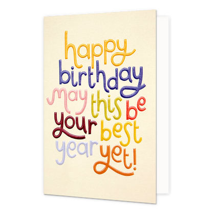 Happy birthday - Formaat: Normaal - Vorm: Staand - Verjaardagskaart - Op deze wenskaart staat de tekst "happy birthday may this be your best year yet!" centraal tegen een lichtbeige achtergrond. De woorden zijn uitgevoerd in een speels, handgeschreven lettertype waarbij elke regel of elk woord een andere kleur heeft, zoals geel, blauw, roze, groen, rood, paars en oranje. De letters lijken een licht reliëf of een geborduurd effect te hebben, wat de kaart een tactiele uitstraling geeft. - Snelwenskaart