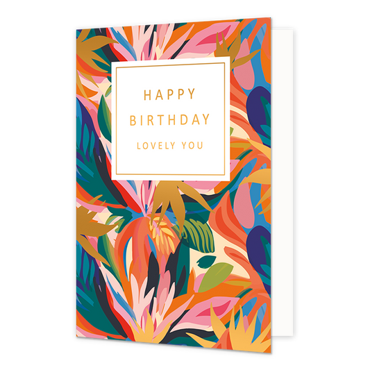 Happy Birthday lovely you - Formaat: Normaal - Vorm: Staand - Verjaardagskaart - Op deze artistieke wenskaart is een ontwerp te zien waarbij abstrakte bladeren te zien zijn in de kleuren rood, roze, wit, goud, blauw, groen en oranje. In het midden zit een wit blok met de gouden tekst: "Happy birthday lovely you". - Snelwenskaart