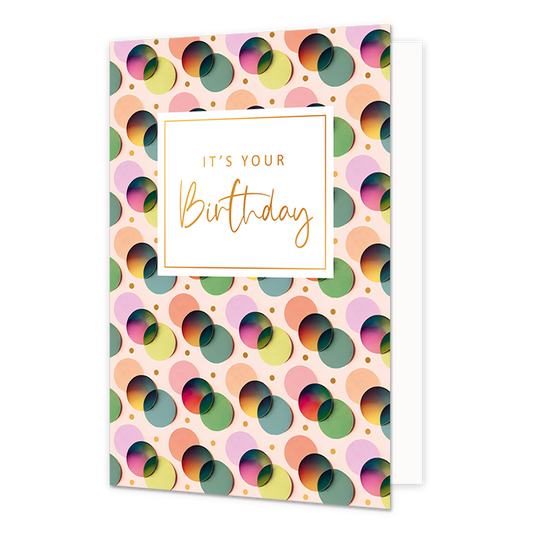 It's your birthday - Formaat: Normaal - Vorm: Staand - Verjaardagskaart - Op deze wenskaart zijn stippen te zien in de kleuren lila, orangje, groen, blauw en rood. In het midden zit een wit blok met de gouden tekst: "It's your birthday". - Snelwenskaart