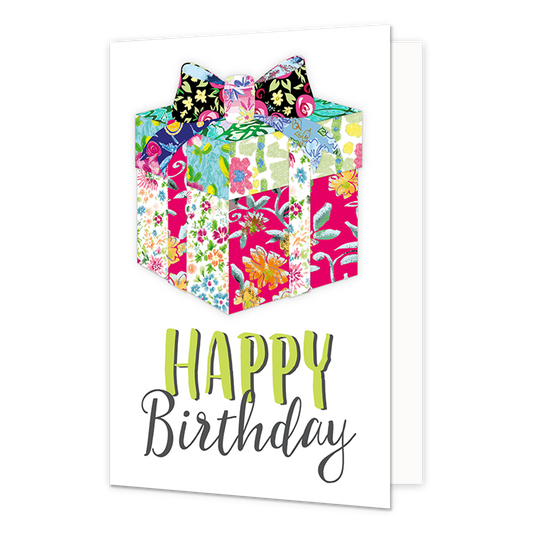 Happy birthday - Formaat: Normaal - Vorm: Staand - Verjaardagskaart - Op deze wenskaart staat een witte achtergrond met in het midden een kleurrijke illustratie van een ingepakt cadeau. Het cadeau en de grote strik bovenop zijn samengesteld uit verschillende vrolijke bloemen- en bladpatronen in felle kleuren zoals roze, blauw, groen en geel. Onder het cadeau staat de tekst "HAPPY Birthday". Het woord "HAPPY" is uitgevoerd in gifgroene blokletters met een zwart schaduweffect, en "Birthday" staat daaronder i