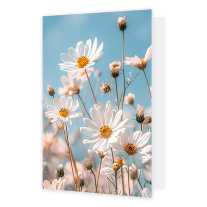 Op deze wenskaart staat een afbeelding van witte bloemen.