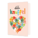Dikke knuffel - Formaat: Klein - Vorm: Staand - Vriendschapskaart - Op deze wenskaart staat een hartje gemaakt van bloemen in de kleuren rood, groen, blauw, geel, roze en wit. Daarboven staat de tekst: "Dikke knuffel". - Snelwenskaart
