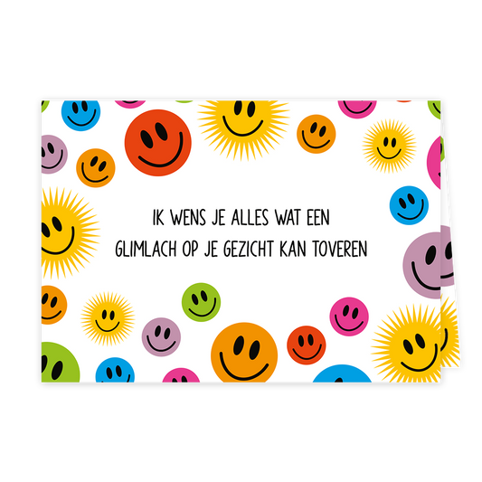 Glimlach op je gezicht - Formaat: Klein - Vorm: Liggend - Denken aan kaart - Op deze wenskaart staan smiley in diverse kleuren met in het midden de tekst: "Ik wens je alles wat een glimlach op je gezicht kan toveren". - Snelwenskaart