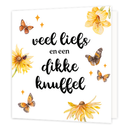 Op deze wenskaart staan bloemen en vlinders met in het midden de tekst: "Veel liefs en een dikke knuffel". 