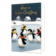 Have a (n)ice christmas - Formaat: Standaard - Vorm: Staand - Kerstkaart - Op deze wenskaart zijn vijf schaatsende pinguïns te zien op een bevroren meer, met op de achtergrond een winters landschap met besneeuwde huizen en bomen. De pinguïns dragen vrolijke mutsen en sjaals in verschillende kleuren zoals geel, oranje en rood, en schaatsen vrolijk rond. De donkerblauwe nachthemel boven het tafereel is gevuld met subtiele witte sneeuwvlokken. Bovenaan de illustratie staat de goudkleurige, sierlijke tekst "Ha