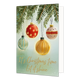 It's christmas time let it shine - Formaat: Standaard - Vorm: Staand - Kerstkaart - Op deze wenskaart hangen vier verschillende kerstballen aan dennentakken tegen een zachte, groene achtergrond. De kerstballen hebben elk een eigen kleur en patroon, waaronder rood met stippen, groen en oranje met strepen, en een crèmekleurige bal met rood-zwarte details. De achtergrond is onderaan voorzien van subtiele witte stipjes en de goudkleurige handgeschreven tekst "It's Christmas time Let it shine". - Snelwenskaart