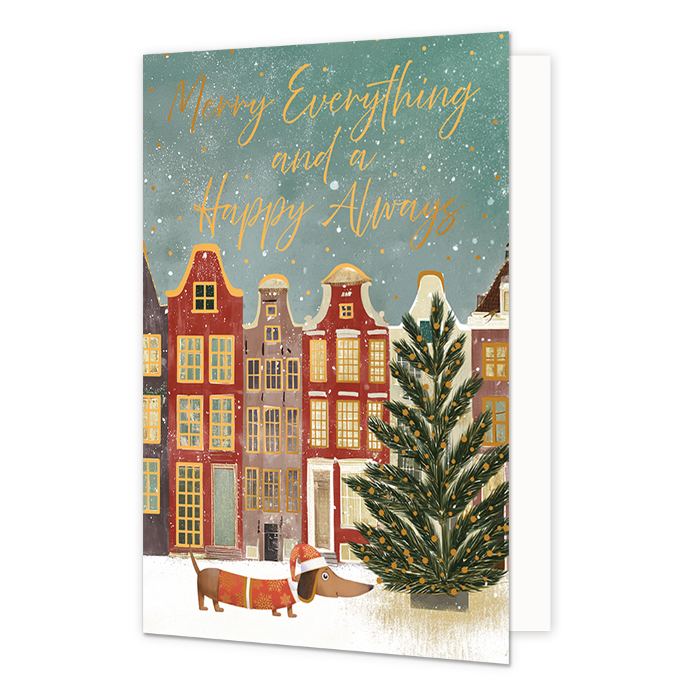 Merry everything and a happy always - Formaat: Standaard - Vorm: Staand - Kerstkaart - Op deze wenskaart is een winterse stadsgezicht te zien met traditionele grachtenpandjes en een grote kerstboom op de besneeuwde voorgrond. Onderaan loopt een dachshund hondje dat een kerstmuts en een kersttrui draagt door de sneeuw. De lucht is groenblauw van kleur en gevuld met vallende sneeuwvlokken en gouden stipjes. Bovenaan de illustratie staat de goudkleurige handgeschreven tekst "Merry Everything and a Happy Alway