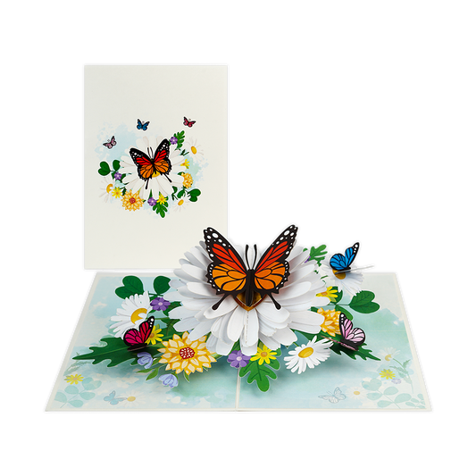 Vlinderbloem - Formaat: Normaal - Vorm: Staand - Blanco kaart - Op deze wenskaart staat een grote vlinder die op een witte bloem zit, omringt door kleinere vlinders en bloemen. - Snelwenskaart