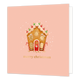 Merry christmas - Formaat: Standaard - Vorm: Vierkant - Kerstkaart - Op deze wenskaart staat een charmante illustratie van een peperkoekhuisje dat rijkelijk is versierd met 'glazuur', gekleurde snoepjes op het dak en twee rood-wit gestreepte zuurstokken bij de ingang. Het huisje wordt omringd door zachte witte sneeuwvlokjes tegen een warme, zalmroze achtergrond. Onderaan de kaart staat in elegante goudkleurige letters de wens "merry christmas". - Snelwenskaart