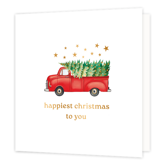 Happy christmas to you - Formaat: Normaal - Vorm: Vierkant - Kerstkaart - Op deze wenskaart staat een charmante illustratie van een klassieke rode pick-uptruck die een prachtig versierde kerstboom vervoert. Boven de truck zweven fonkelende gouden sterretjes tegen een heldere, witte achtergrond. Onderaan de kaart staat in een elegant gouden lettertype de wens "happiest christmas to you". - Snelwenskaart