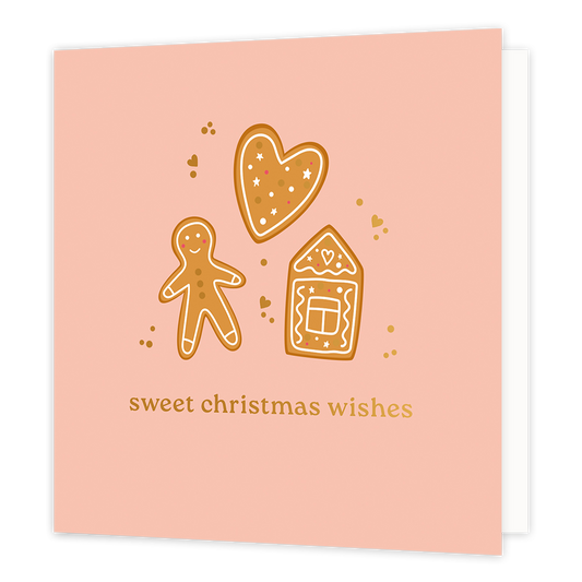 Sweet christmas wishes - Formaat: Normaal - Vorm: Vierkant - Kerstkaart - Op deze wenskaart staat een charmante illustratie van drie peperkoekfiguren: een mannetje, een hartje en een huisje, versierd met witte glazuurdetails. De figuren worden omringd door kleine gouden hartjes en stipjes tegen een zachte, zalmroze achtergrond. Onderaan de kaart staat de tekst "sweet christmas wishes" geschreven in goudkleurige letters. - Snelwenskaart