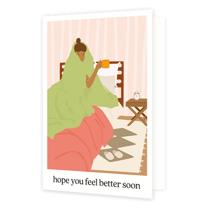Hope you feel better soon - Formaat: Standaard - Vorm: Staand - Beterschapskaart - Op deze wenskaart staat een vrouw die in bed ligt met een deken over haar heen en een mok in de hand. Onder de illustratie staat de tekst: "Hope you feel better soon". - Snelwenskaart