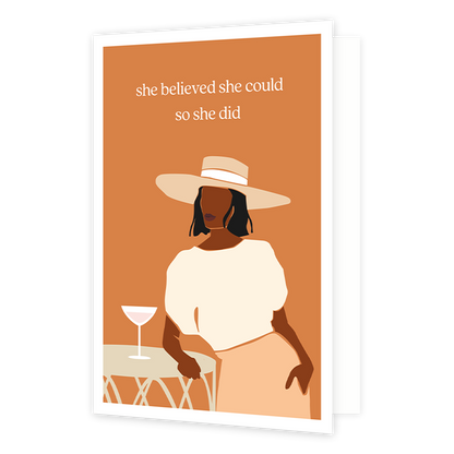 She believed she could so she did - Formaat: Normaal - Vorm: Staand - Succes kaart - Op deze wenskaart staat en vrouw die aan een tafel staat waar een cocktail glas op staat. Boven de illustratie staat de tekst: "She believed sh could so she did". - Snelwenskaart