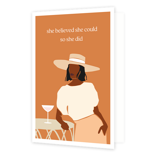She believed she could so she did - Formaat: Normaal - Vorm: Staand - Succes kaart - Op deze wenskaart staat en vrouw die aan een tafel staat waar een cocktail glas op staat. Boven de illustratie staat de tekst: "She believed sh could so she did". - Snelwenskaart