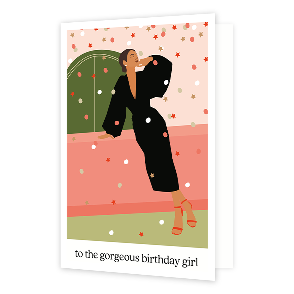 To the gorgeous birthday girl - Formaat: Normaal - Vorm: Staand - Verjaardagskaart - Op deze wenskaart staat een vrouw in een zwarte jurk die op een roze tafel leunt. Onder de illustratie staat de tekst: "To the gorgeous birthday girl". - Snelwenskaart