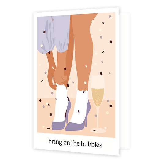 Bring on the bubbles - Formaat: Normaal - Vorm: Staand - Proost kaart - Op deze wenskaart staat een vrouw die paarse hakken aantrekt met een glas champagne ernaast. Onder de illustratie staat de tekst: "Bring on the bubbles". - Snelwenskaart
