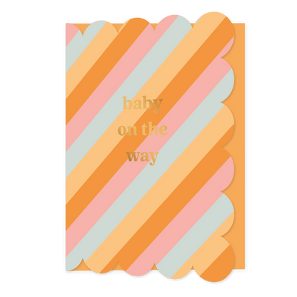 Baby on the way - Formaat: Standaard - Vorm: Staand - Zwanger kaart - Op deze wenskaart staan lijnen in de kleuren oranje, blauw en roze, met in het midden de tekst: "Baby on the way". - Snelwenskaart