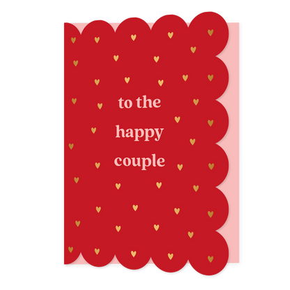 To the happy couple - Formaat: Normaal - Vorm: Staand - Huwelijkskaart - Op deze wenskaart staan gouden hartjes op een rode achtergrond met in het midden de tekst: "To the happy couple". - Snelwenskaart