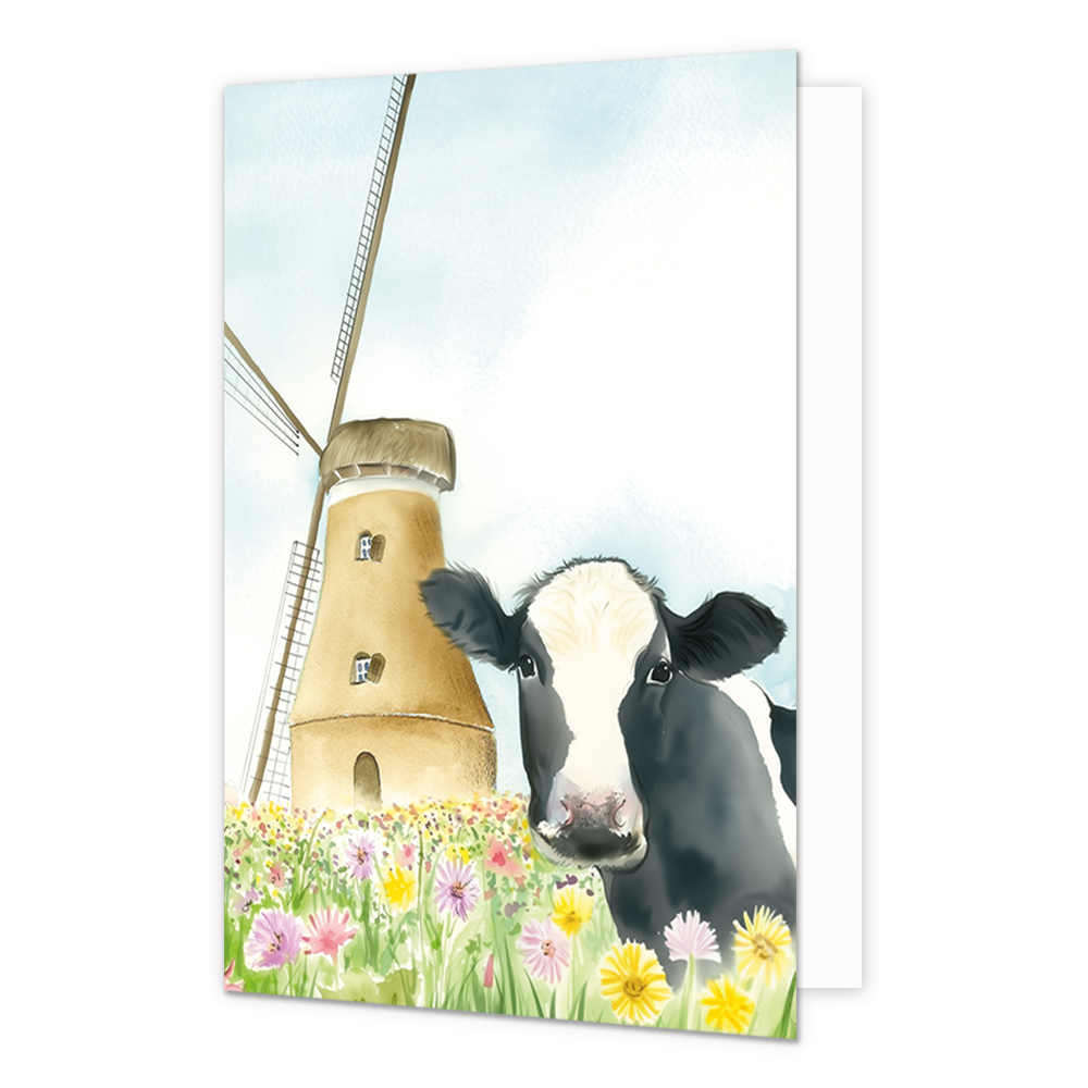 Op deze wenskaart staat een koe tussen de bloemen bij een molen.