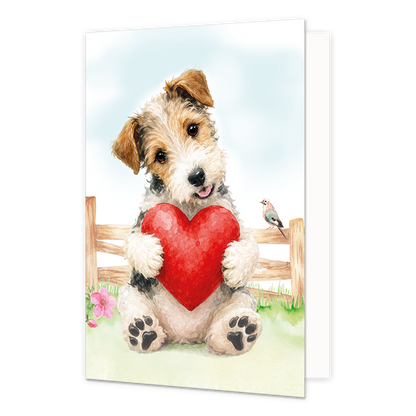 Hond met rood hart - Formaat: Standaard - Vorm: Staand - Liefdeskaart - Op deze wenskaart staat een aquarelillustratie van een schattige, ruwharige puppy die met zijn voorpoten een groot, rood hart vasthoudt. De hond zit voor een houten hek in een grasveld met bloemen, waarbij een klein vogeltje op het hek naast hem rust. De puppy kijkt met een zachte, vrolijke uitdrukking omhoog tegen een lichte achtergrond. - Snelwenskaart