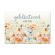 Postcard Gefeliciteerd van ons - 10 stuks - Formaat: Standaard - Vorm: Liggend - Postcards - Op deze postcard staat de tekst: "Gefeliciteerd van ons" met daaronder bloemen in de kleuren oranje, beige, wit en blauw. - Snelwenskaart