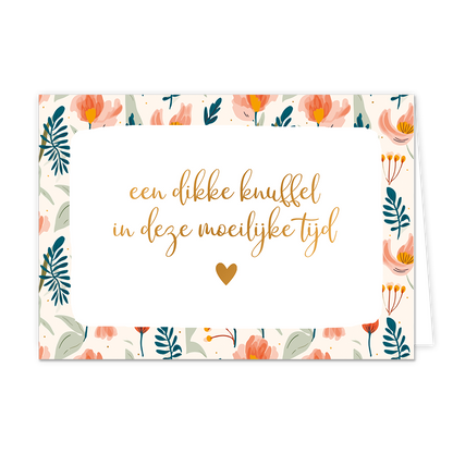 Een dikke knuffel in deze moeilijke tijd - Formaat: Standaard - Vorm: Liggend - Denken aan kaart - Op deze wenskaart staan bloemen in de kleuren roze, beige en geel, met groene en blauwe bladeren. In het midden staat de tekst: "Een dikke knuffel in deze moeilijke tijd". - Snelwenskaart