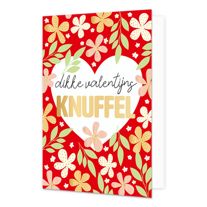 Dikke Valentijnsknuffel - Formaat: Normaal - Vorm: Staand - Valentijnskaart - Op deze wenskaart staat een wit hart omringt door bloemen en in het midden de tekst: "Dikke Valentijnsknuffel". - Snelwenskaart
