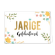 Jarige gefeliciteerd - Formaat: Standaard - Vorm: Liggend - Verjaardagskaart - Op deze wenskaart zie je verschillende bloemen en takken in verschillende kleuren. In het midden staat in het goud de tekst 'jarige' en daaronder in het zwart de tekst 'gefeliciteerd'. - Snelwenskaart
