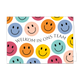 Welkom in ons team - Formaat: Standaard - Vorm: Liggend - Welkom kaart - Op deze wenskaart staan smileys in de kleuren paars, beige, oranje, geel, groen en rood met in het midden de tekst: "Welkom in ons team". - Snelwenskaart