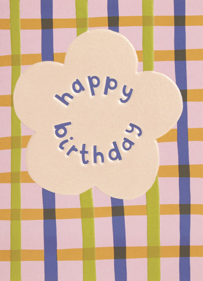 Op deze wenskaart staat lijnen in de kleuren oranje, geel, groen en blauw met een beige bloem en de tekst: "Happy birthday".