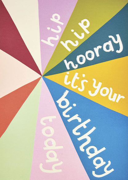 Op deze wenskaart staan lijnen in de kleuren rood, beige, oranje, groen, roze, blauw en geel met de tekst: "Hip hip hooray it's your birthday today".